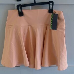 PINSPARK Pleated Athletic Skirt with Built in Spandex